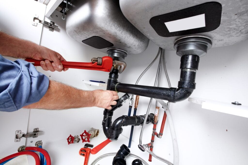 Titusville Plumbing Pros fixing under sink plumbing and drain pipes